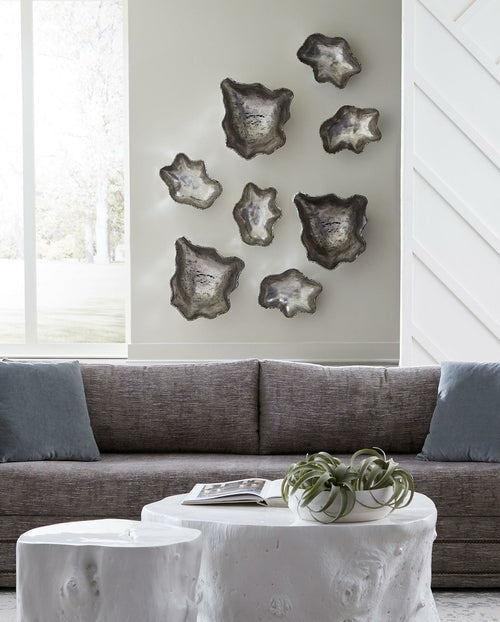 Escultura de pared pequeña de plata y ónix fundido