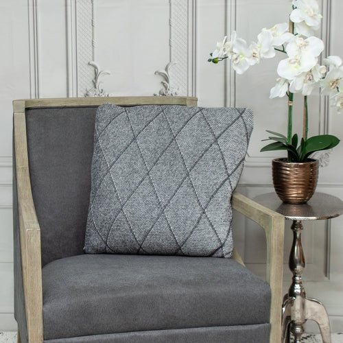 Cojín de algodón tejido con estampado de rombos