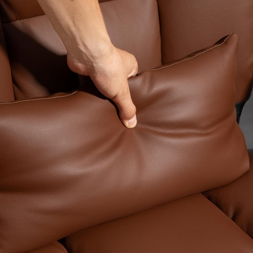 Sillón ejecutivo reclinable de cuero marrón con respaldo alto y reposapiés