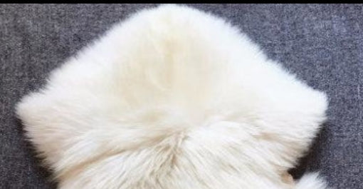 Alfombra de piel de cordero color marfil 